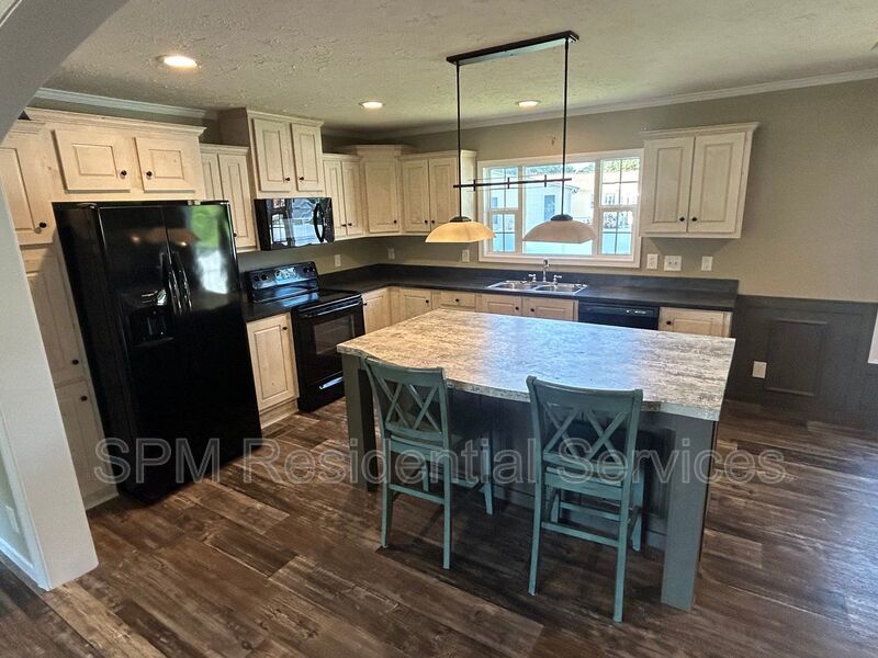 Large fenced backyard, Community Pool, and Kitchen Island property image