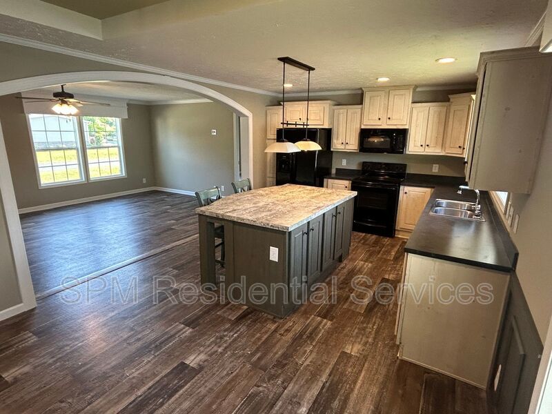 Large fenced backyard, Community Pool, and Kitchen Island property image