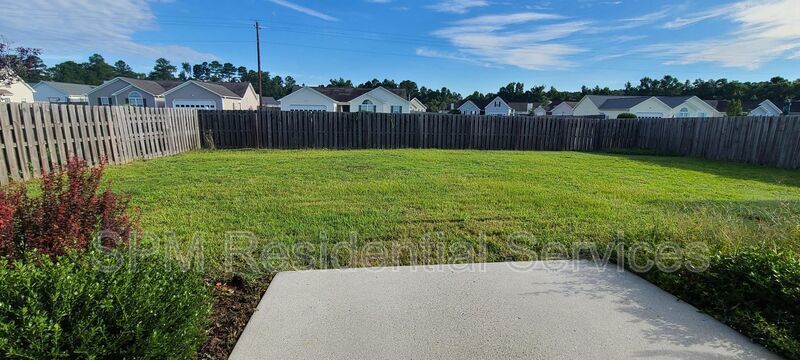 Fenced in backyard, Trash included, large primary bedroom. property image